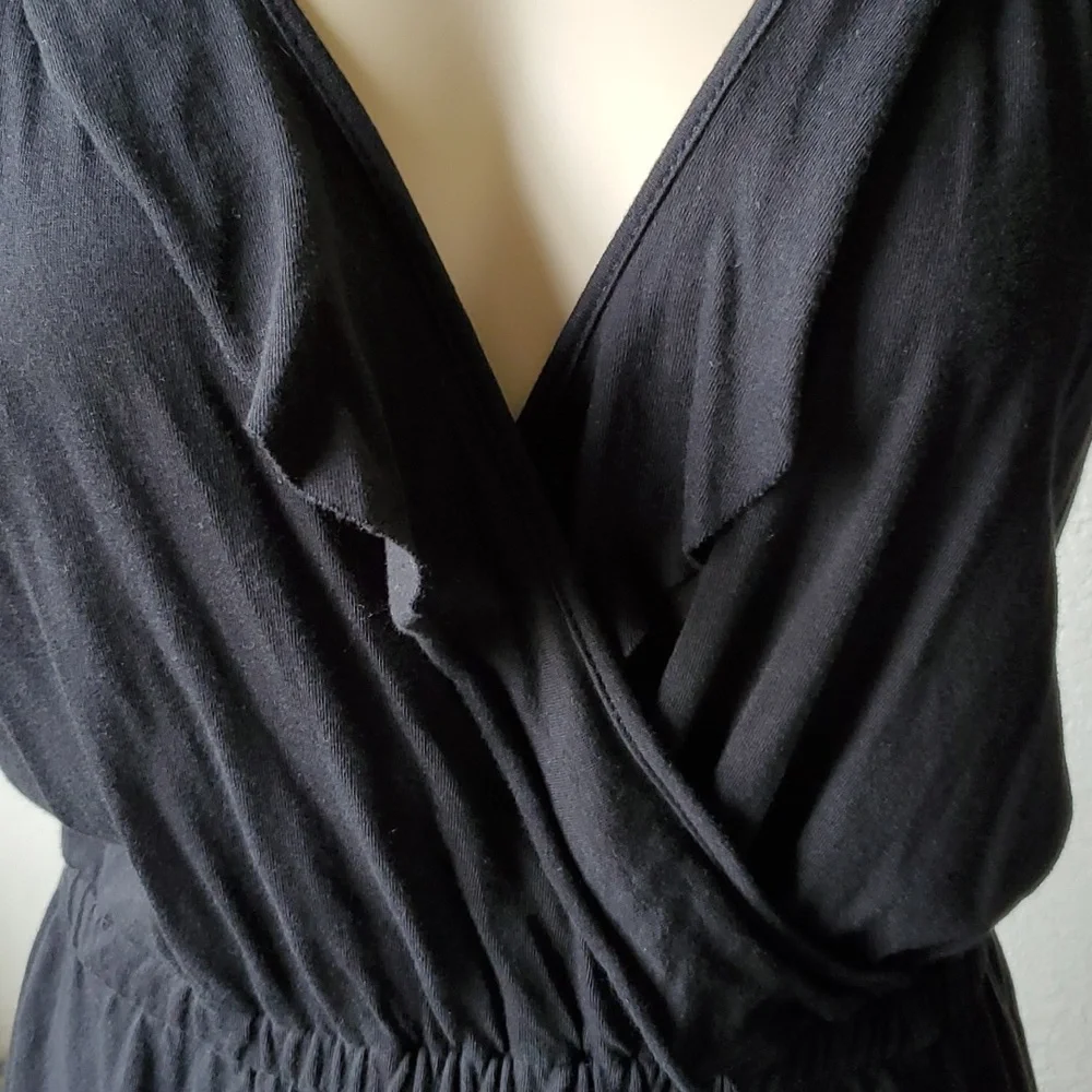 Like new, Romper black with ruffle and trim so cute split up the sides of short - Picture 3 of 7